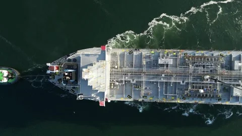 Top view of a tanker being assisted by tugboats Stock Footage 291589913