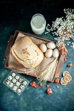 Top view tasty fresh bread with eggs and milk on dark background cake pie t.. Stock Photos