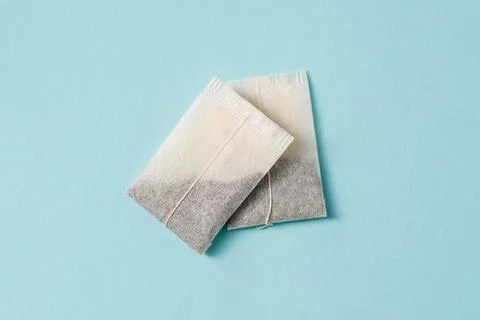Top view of tea bag on blue background Stock Photos