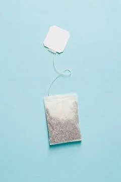 Top view of tea bag on blue background Stock Photos