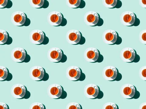 Top view of tea time seamless pattern with tea cups with arrows and saucers o Stock Photos