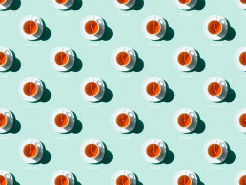 Top view of tea time seamless pattern with tea cups and saucers on blue Stock Photos