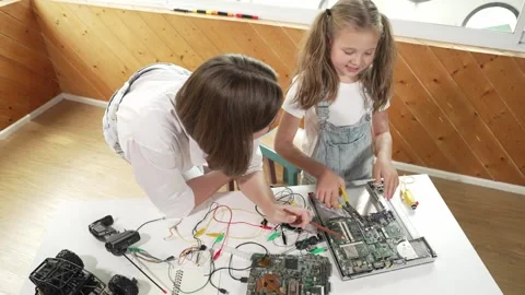 Top view of teacher teaching student about part of electronic board. Erudition. Stock Footage 277218770