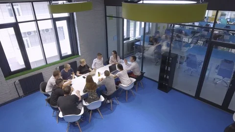 Top view of the team of creatives in a beautiful office. Video stock 98294378