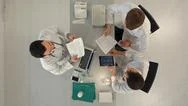 Top View Of Team Of Doctors Having A Meeting In Medical Office Stock Photos