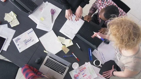 Top view of team having a discussion at the office Stock Footage 73854697