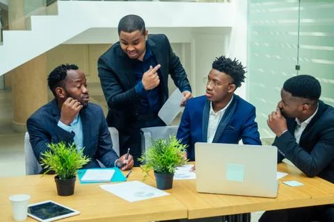 Top view of team work high five a group of successful afro americans, europeans Stock Photos