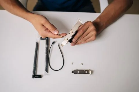 Top view of technician assembling wi-fi module with heatsink preparing to Stock Photos
