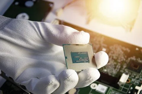 Top view of technician holding CPU in hand. AI processing chip concept. 스톡 사진