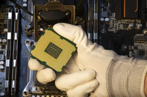Top view of technician installing CPU chip on motherboard, CPU chip It's th.. Stock Photos