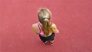 Top View Of Teenager Girl Athlete Stretching Before Running On Stadium Stock Footage