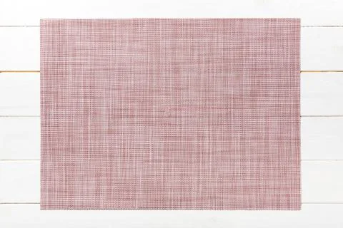 Top view of textile brown mat for dinner on wooden background with copy space Stock Photos