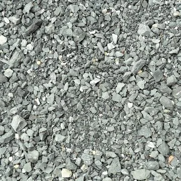 Top view texture of grey crushed stone and gravel background. Stock Photos