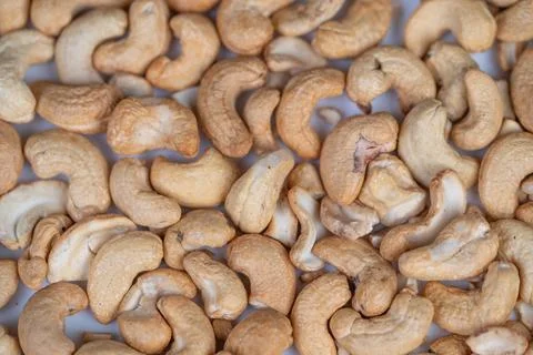 Top view of textured cashew pattern with natural tones. Repeating macro cashew d 写真素材