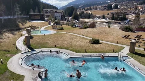 Top view of the thermal pools in the mountains. Dolomite Alps. Pozza di Fassa. Stock Footage 239343817