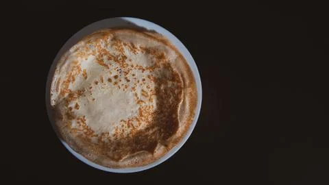 Top view of thin pancake on black background and copy space Stock Photos