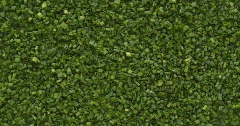 Top view of thinly chopped chives background.Table spin. Vertical video. Stock Footage 277913291