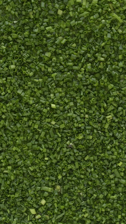 Top view of thinly chopped chives background. Table spin. vertical video. Video stock 277913584