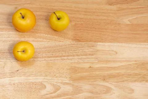 Top view of three apples with copyspace on a wooden table Stock Photos