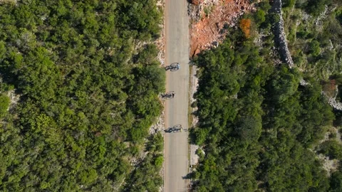 Top view three cyclists rides on the road, Stock-Footage 229458710