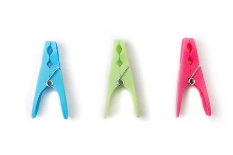 Top view of three different color clothespins isolated on white background Stock Photos