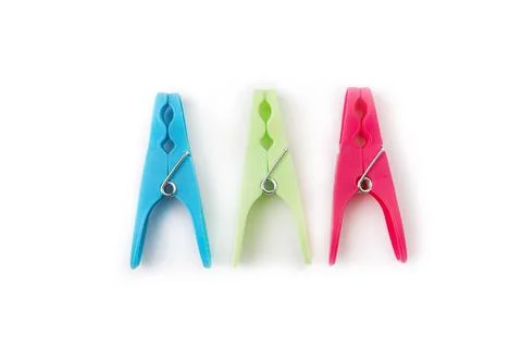 Top view of three different color clothespins isolated on white background Stock Photos