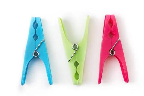 Top view of three different color clothespins isolated on white background Stock Photos