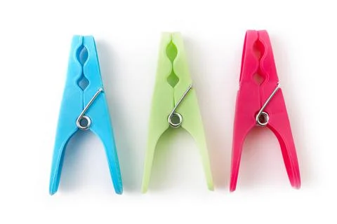 Top view of three different color clothespins isolated on white background Stock Photos