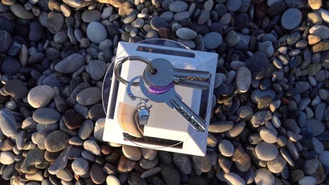 Top view Three keys are turning on solar showcase on the beach Stock Footage 98296925