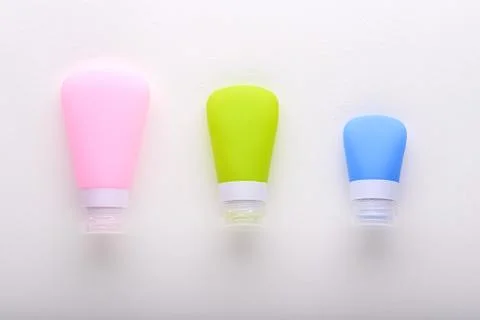 Top view three matte multi-colored tube on white background Stock Photos
