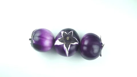 Top View Three Round Purple Eggplants Rotating On White Background. Stock Footage 340609734