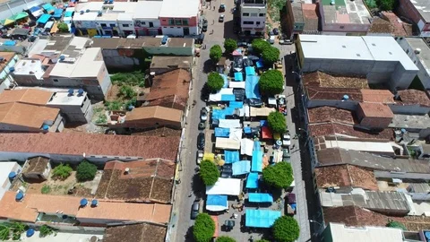 Top view tilt down &amp; track of a busy Brazillian Market Town. 库存影片 73224536
