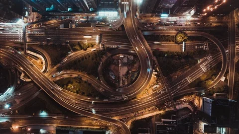 Top view time-lapse of car traffic at night on highway winding road, zoom out Stock Footage 113226278