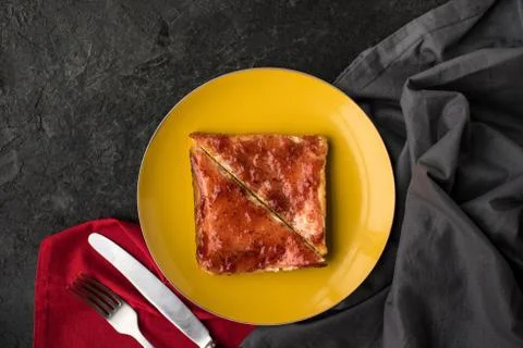 Top view of toasts with jam for breakfast on plate on dark tabletop Stock-Fotos