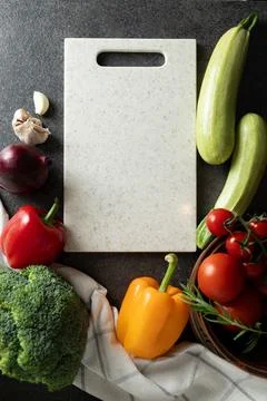 Top view of tomatoes, bell pepper, broccoli, garlic, red onion, empty cutting Stock Photos