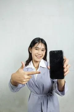 Top view towards the camera of a working woman pointing Stock Photos