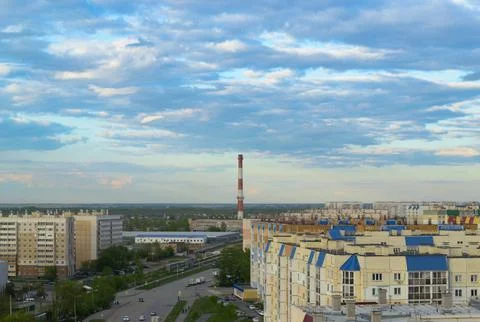 Top view of the town with many multi-storey buildings under a cloudy sky Stock Photos