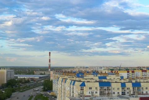 Top view of the town with many multi-storey buildings under a cloudy sky Stock Photos