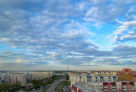 Top view of the town with many multi-storey buildings under a cloudy sky Stock Photos