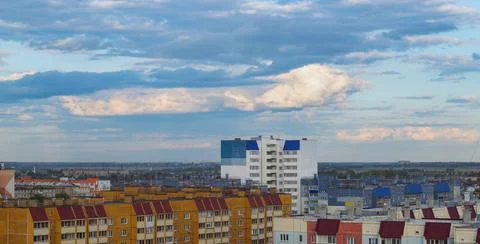 Top view of the town with many multi-storey buildings under a cloudy sky Stock Photos