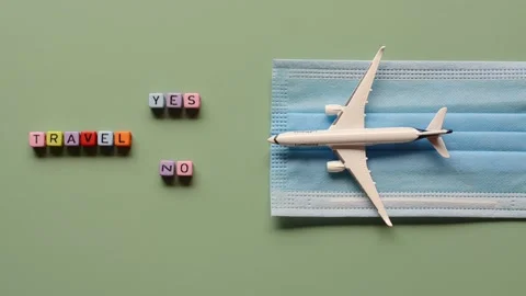 Top view of toy airplane close up, cube beads, medical face mask. Video stock 219382949