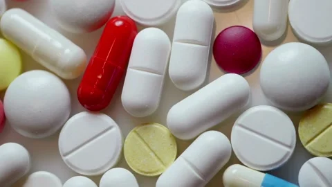 Top view tracking shot of colorful medicine pills and capsules Stock Footage 333485669