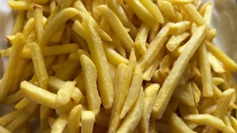 Top view tracking shot of freshly fried fries Stock Footage 279899705