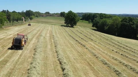 Top view of a tractor doing round ballers Stock Footage 144484024