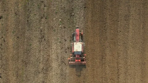 Top View Of Tractor Harrowing Soil In Agricultural Field. Stock-Footage 273167204