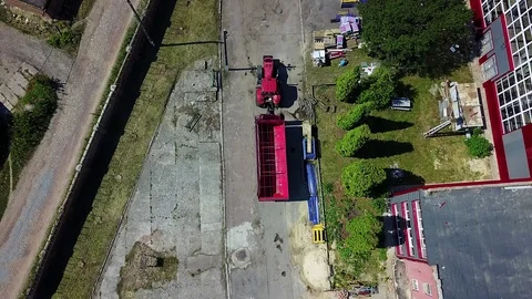 Top view of tractor is moving in from the factory Video stock 108456737