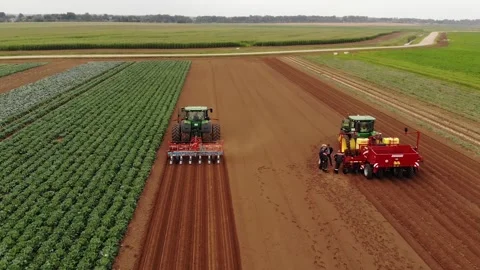 Top view of tractor planting seed in field 스톡 동영상 243735676