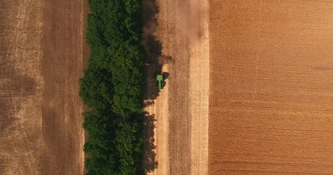 Top view of the tractor ploughing up the field after gathering in wheat 2 Stock Footage 109303978