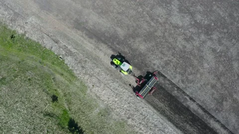 Top view of a tractor plowing the ground Video stock 211145994