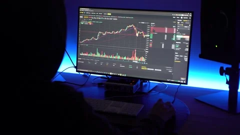 Top view of a trader looking at financial chart trading bitcoin and Stock Footage 149541436